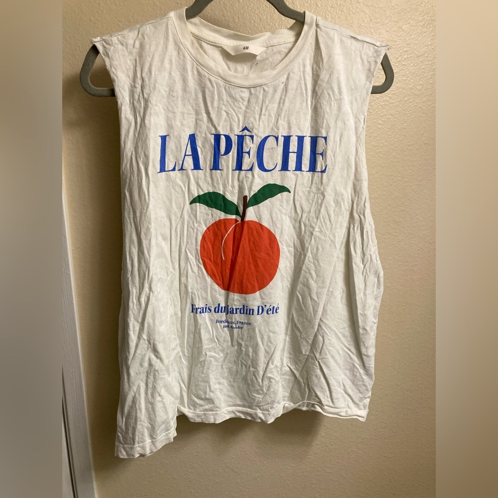 H&M le peche teeshirt with the sleeves cut off.